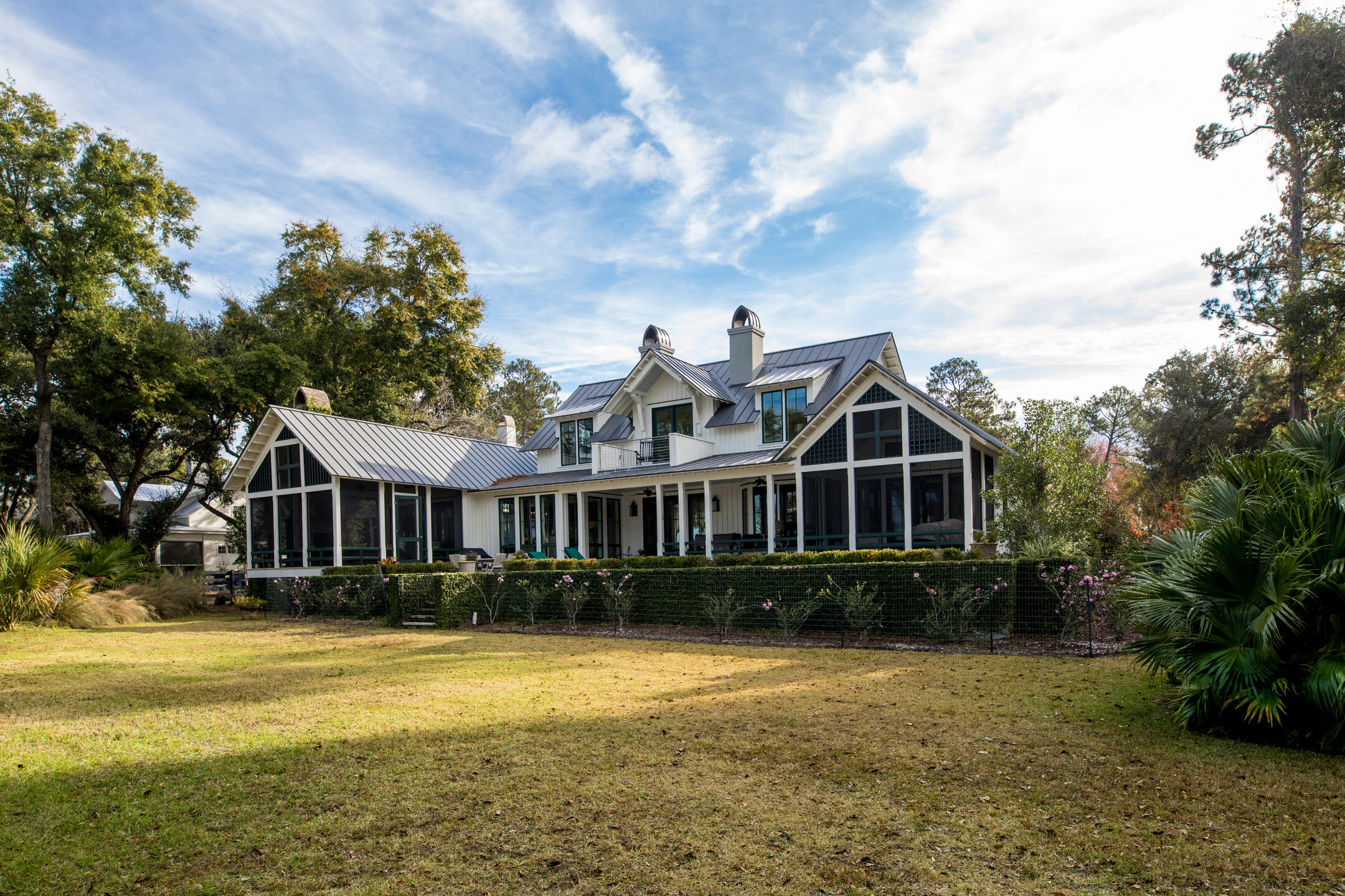 metal roofing fort pierce fl-distant view of gray metal roofing on a house with large lawn