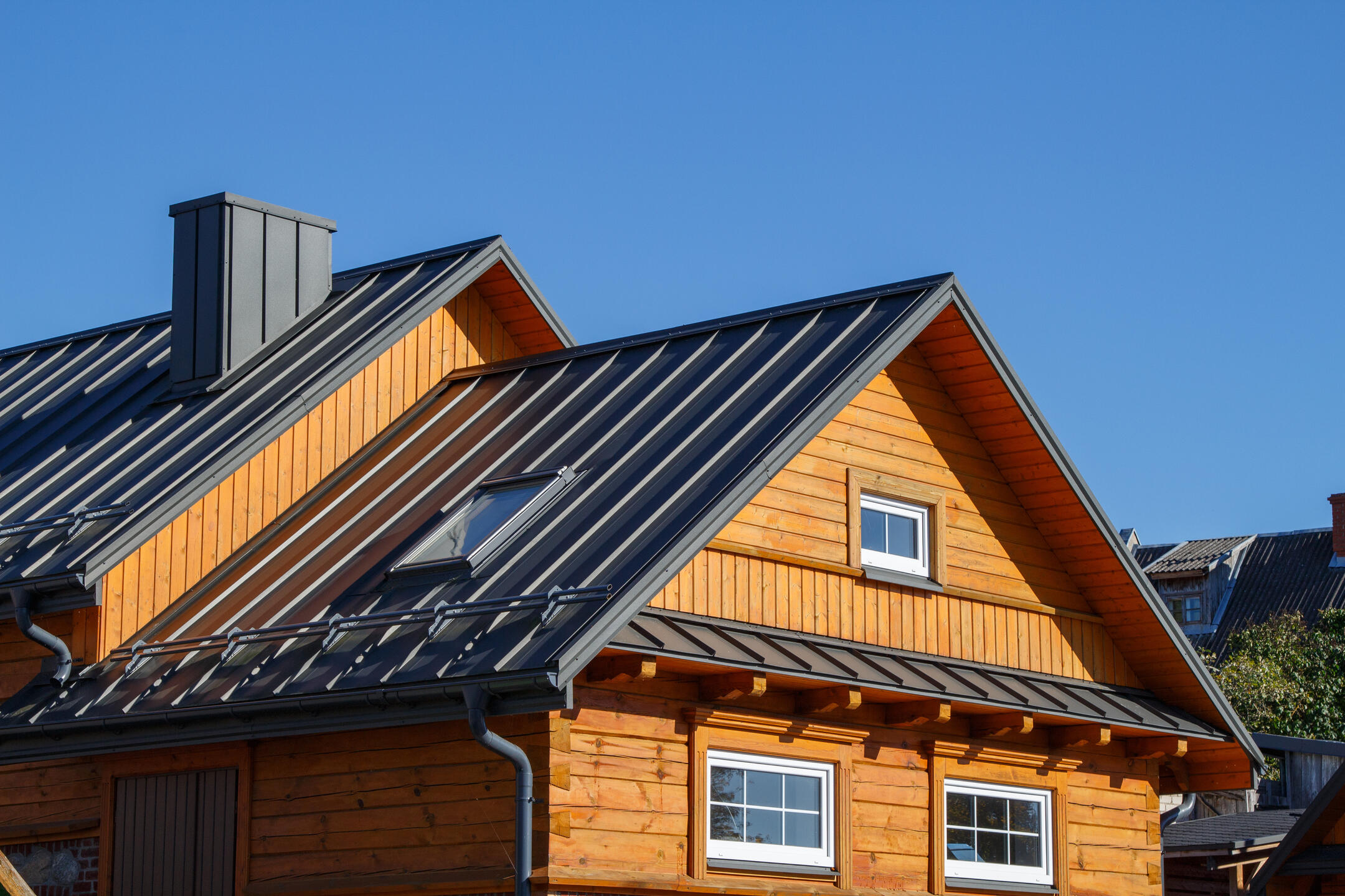 metal roofing okeechobee fl-black standing seam metal roof on log house