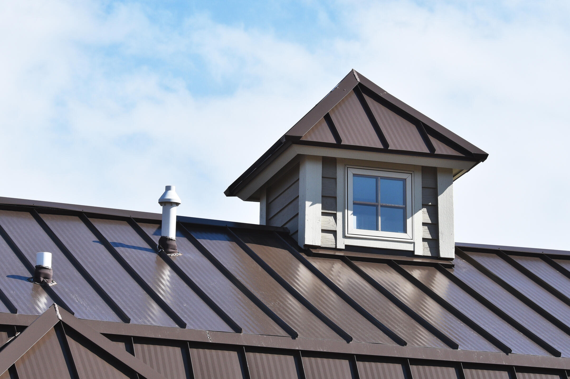 metal roofing sebastian fl-close up brown standing seam metal roof on house