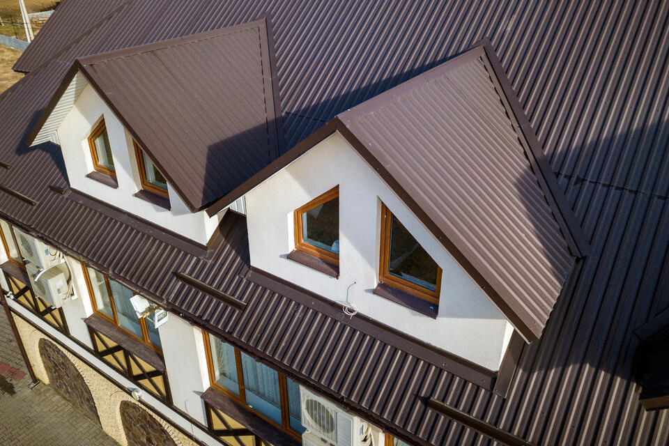 metal roofing vero beach fl-brown corrugated metal roof on a white house