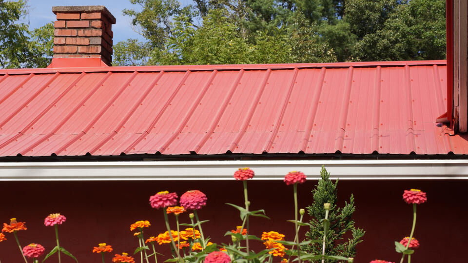 metal roofing west palm beach fl-red standing seam metal roof on brick house