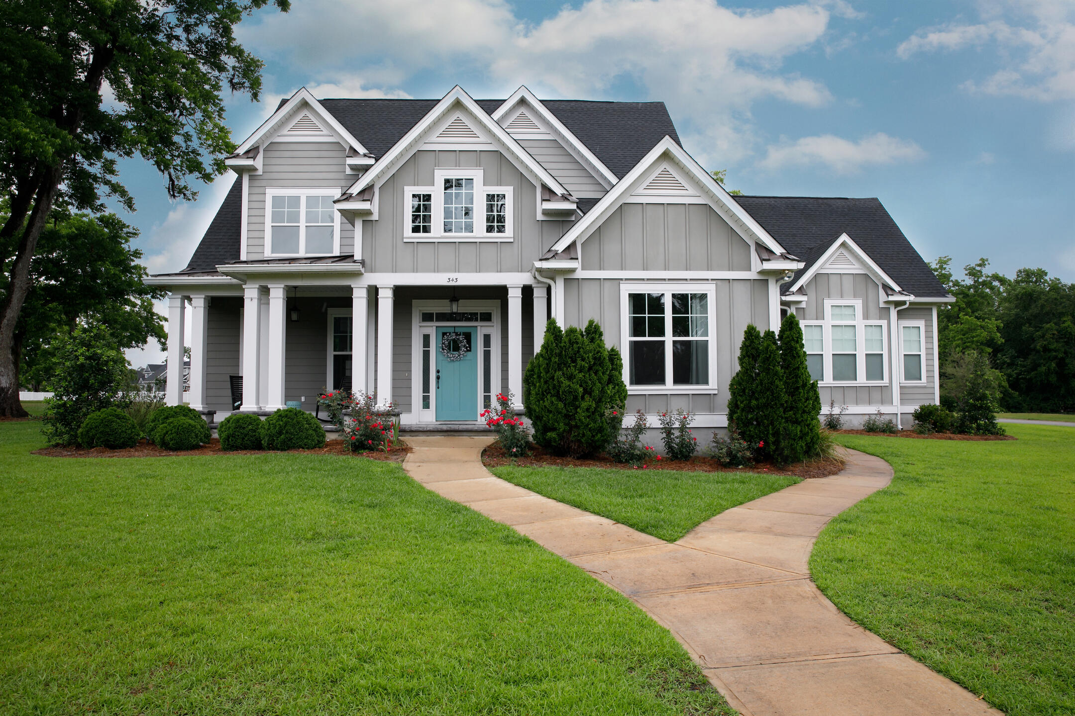 roofing fort pierce fl-gray sided house with black shingles