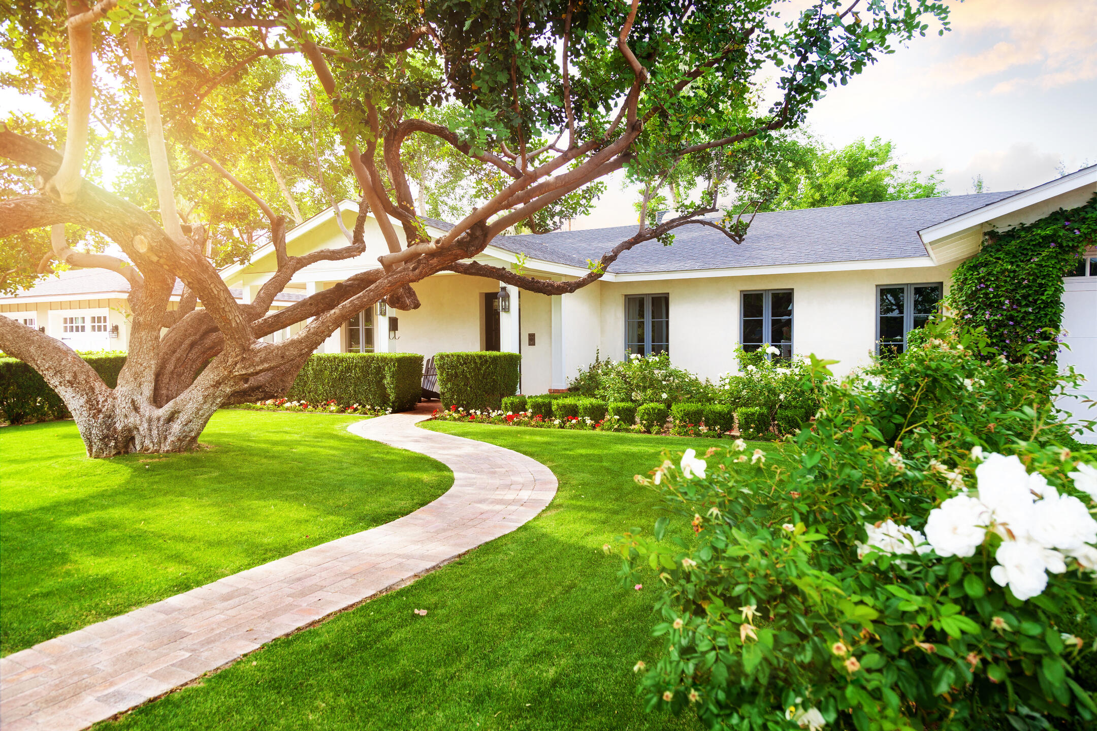 roofing sebastian fl-white sided house with gray shingles